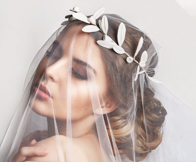 Beautiful bride with fashion wedding hairstyle - on white backgr